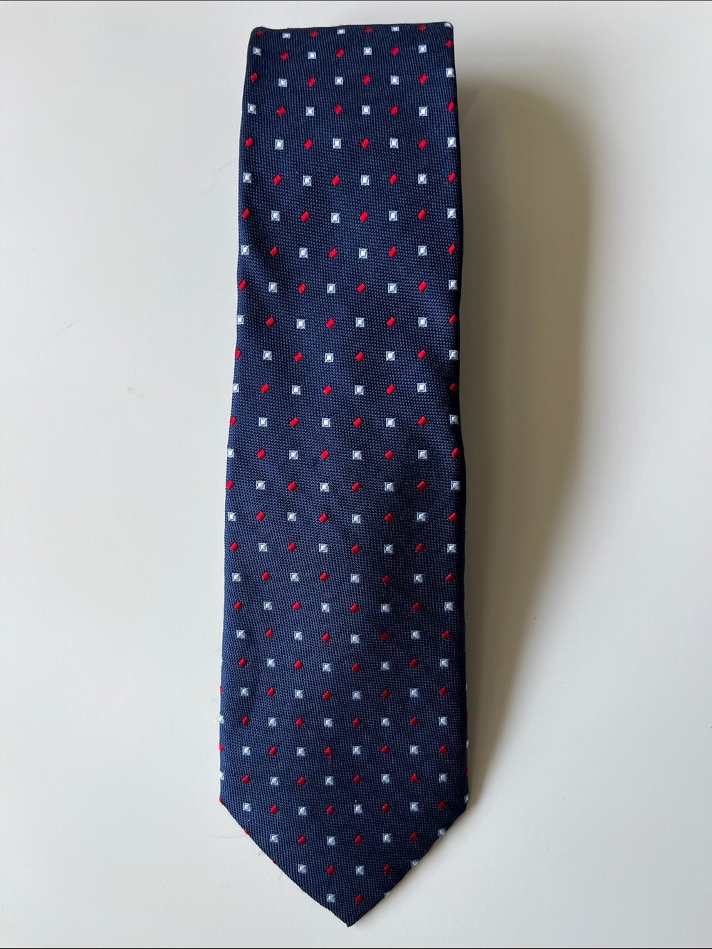 Tom James, corporate image navy blue patterned, small dots and squares silk tie
